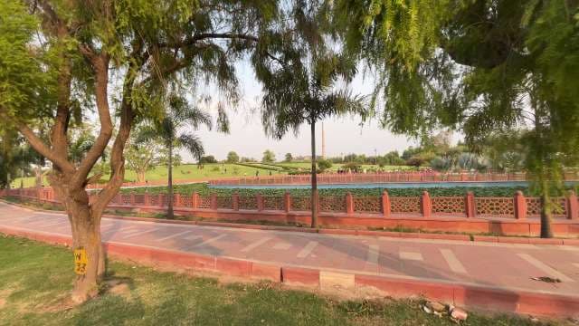 Sunny Day in Beautiful Urban Park With Lush Green Lawns