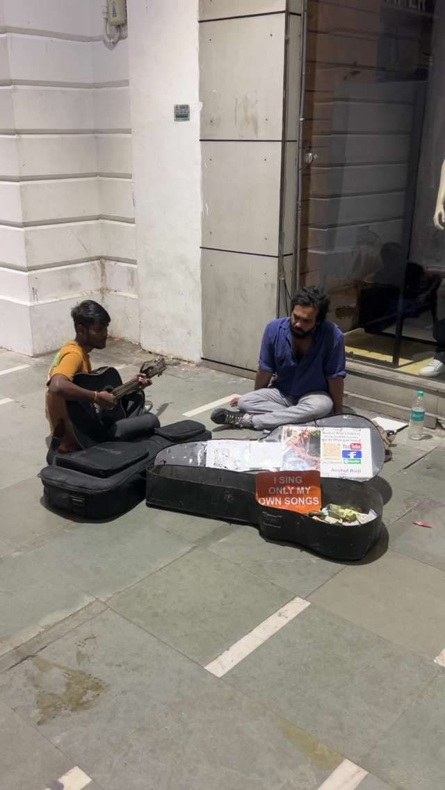 Street Musicians Perform Original Songs in Connaught Place