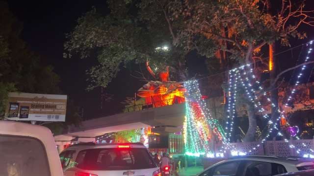 Hanuman Statue Illuminated at Night During Festivities
