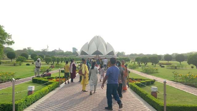 Visitors Explore Iconic Lotus Temple in New Delhi Gardens