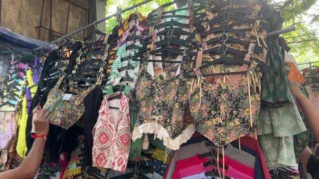 Trendy Floral Crop Tops on Display at Street Market