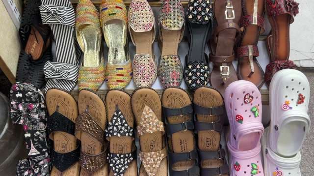 Trendy Women's Sandals and Slippers Displayed in Market