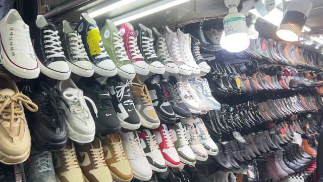 Colorful Sneaker and Shoe Display at Local Market
