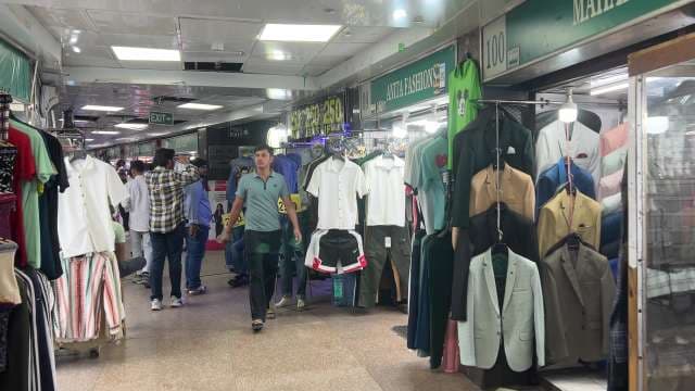 Bustling Indoor Market With Fashion Shops and Shoppers