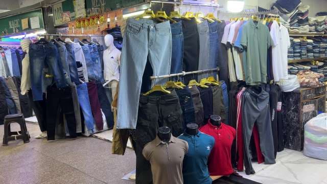 Trendy Men's Jeans and Polo Shirts Display at Local Market