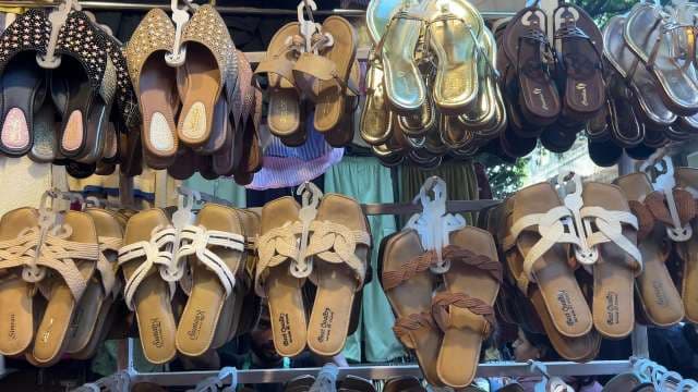 Colorful Women's Sandals Displayed at Outdoor Market Stall