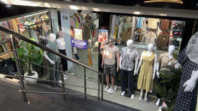 Trendy Clothing Store Display With Mannequins Showcasing Latest Fashion