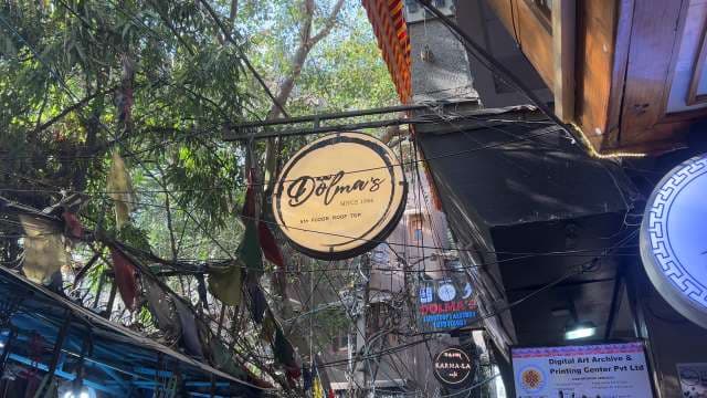 Dolma's Rooftop Cafe Sign in Majnu Ka Tilla, Delhi