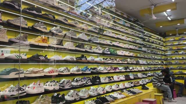 Massive Sneaker Wall Display in Trendy Shoe Store