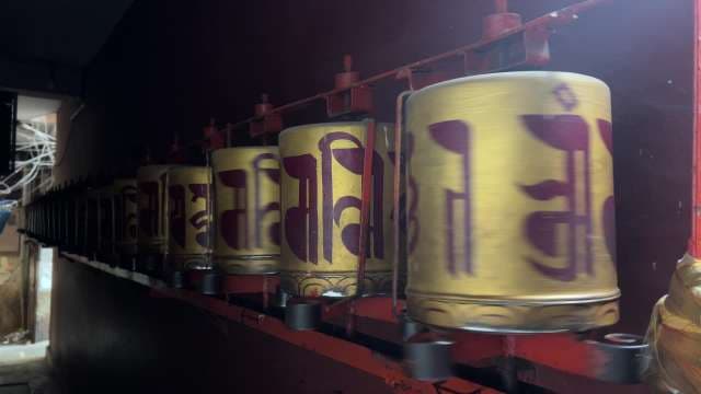 Spinning Tibetan Prayer Wheels in Majnu Ka Tila Alleyway