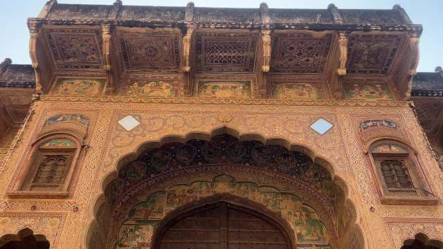 Intricate Rajasthani Fort Gate with Detailed Frescoes