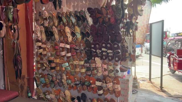 Colorful Traditional Indian Footwear Displayed at Local Market Stall