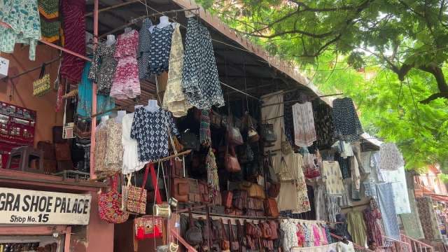 Colorful Indian Street Market Displaying Clothes and Bags
