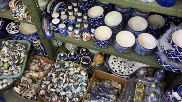 Traditional Blue Pottery Bowls and Accessories on Display