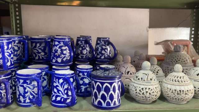 Artisan Blue Pottery Mugs and Handcrafted Decorative Jars Display