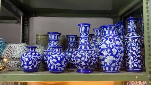 Handcrafted Blue Pottery Vases Displayed on Shelf