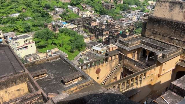 Historic Fort Overlooking Green Hills and Cityscape in India