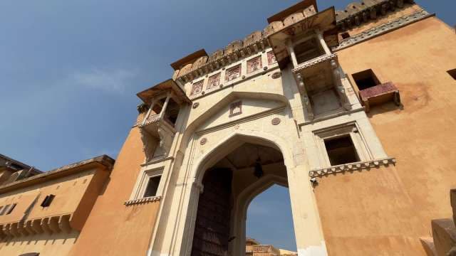 Majestic Historic Fort Entrance Under Clear Blue Sky