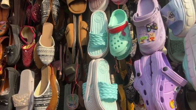 Vibrant Shoe Display at Local Market Stall