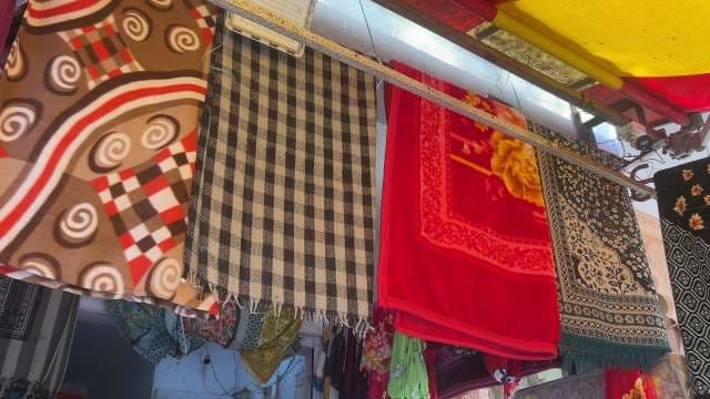 Colorful Throw Blankets Displayed at Street Market