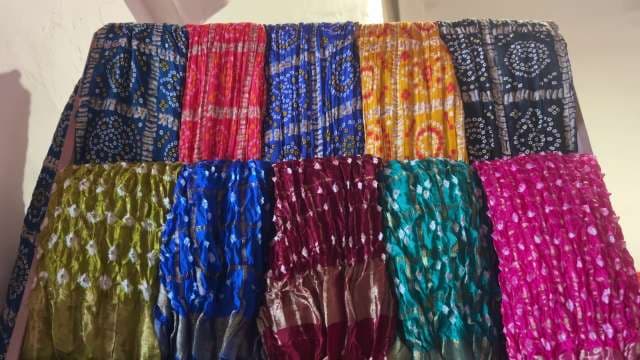 Vibrant Tie-Dye Fabrics Displayed in Bright Patterns