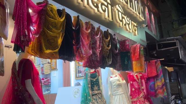 Vibrant Indian Sarees and Lehengas on Display at Market Shop
