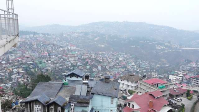 Panoramic View of Kohima Cityscape Amid Misty Hills