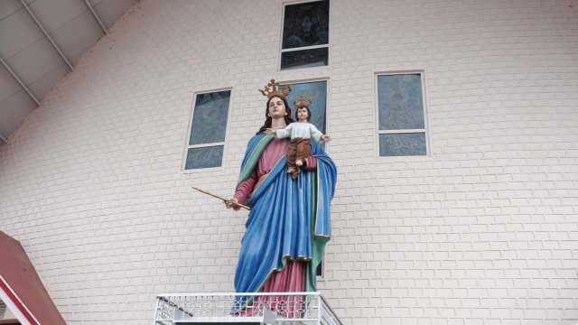Majestic Statue of Mary Help of Christians Outside Church