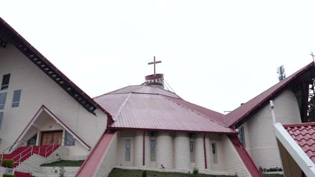Modern Church With Red Roof and Unique Architectural Design