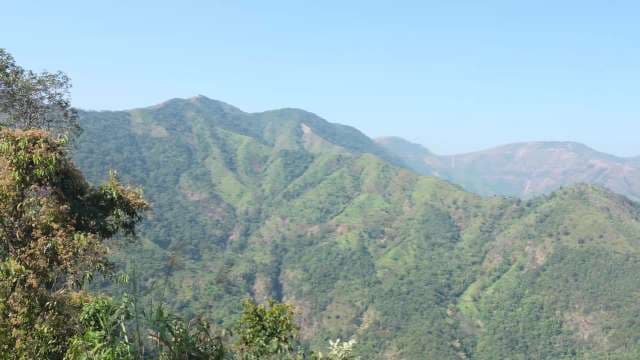 Lush Green Mountain Landscape Under Clear Blue Sky in Kongthong Village, Meghalaya