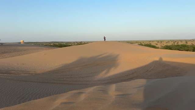 Exploring Majestic Sand Dunes in Thar Desert at Sunset
