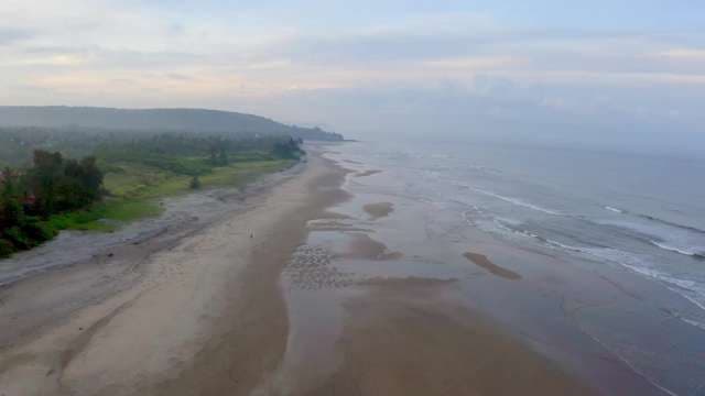 Serene Aerial View of an Empty Tropical Beach Coastline, Goa
