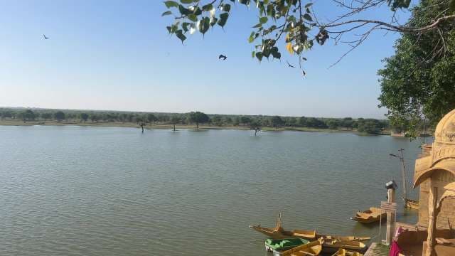 Scenic View of Gadisar Lake With Boats in Jaisalmer