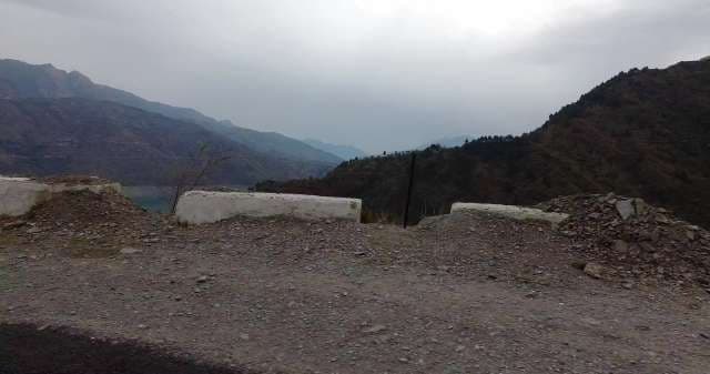 Dramatic Mountain Road With Overcast Sky View