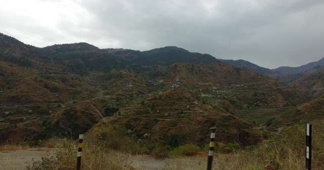 Scenic Mountain Landscape Under Cloudy Sky