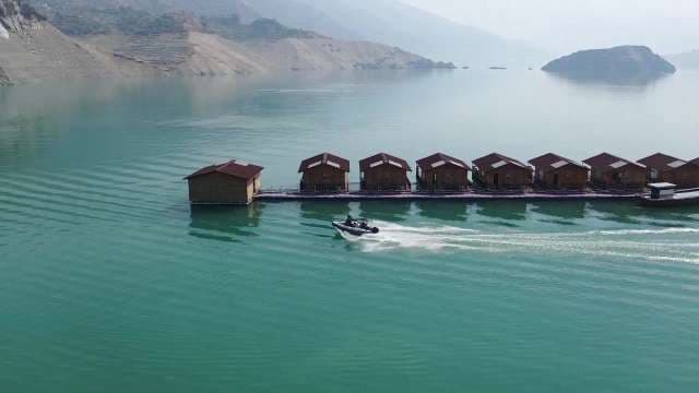 Aerial View of Floating Cabins on Scenic Mountain Lake at Tehri Garhwal