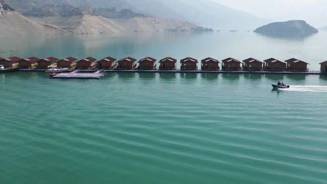 Modern Floating Houses Lined Up on Scenic Lake Tehri Garhwal