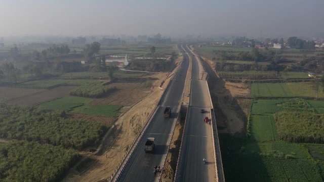 Aerial View of Rural Highway Through Farmland Landscape