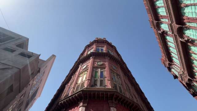 Stunning Historic Red Brick Building Under Clear Blue Sky