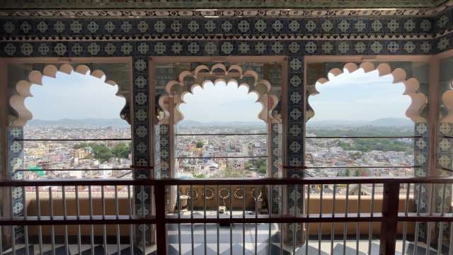 Scenic City View Through Arched Windows at Udaipur Palace