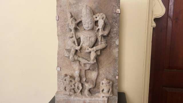 Ancient Indian Stone Sculpture Depicting Multi-Armed Deity