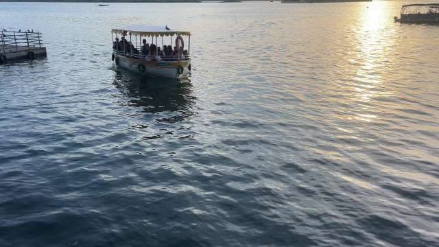 Scenic Boat Ride at Sunset on Tranquil Lake Waters