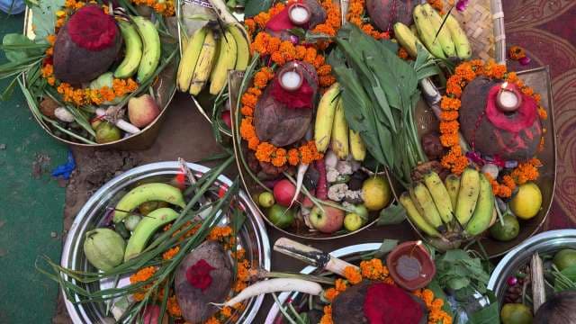 Traditional Indian Puja Offerings With Fresh Fruits and Marigolds