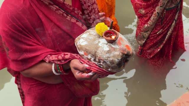 Traditional Chhath Puja Rituals at Riverbank in India