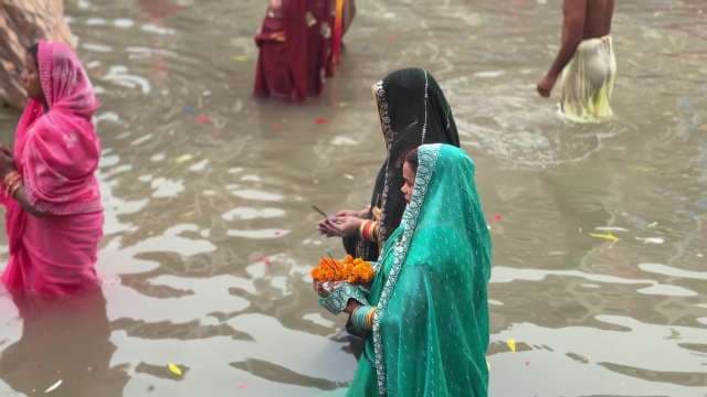 Hindu Devotees Perform Ritual Bath in Sacred River