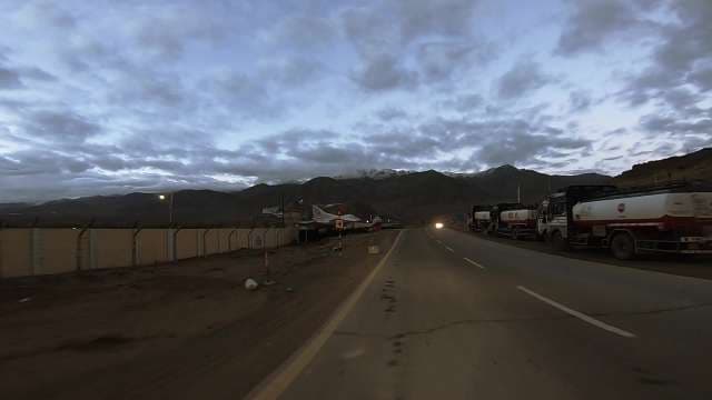 Military-Escorted Fuel Tanker Convoy Through Mali Mountains