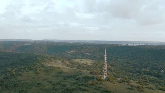 Aerial View of Majestic Radio Tower in Lush Landscape