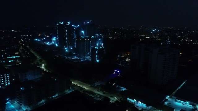 Stunning Night City Skyline with Glowing Blue Lights