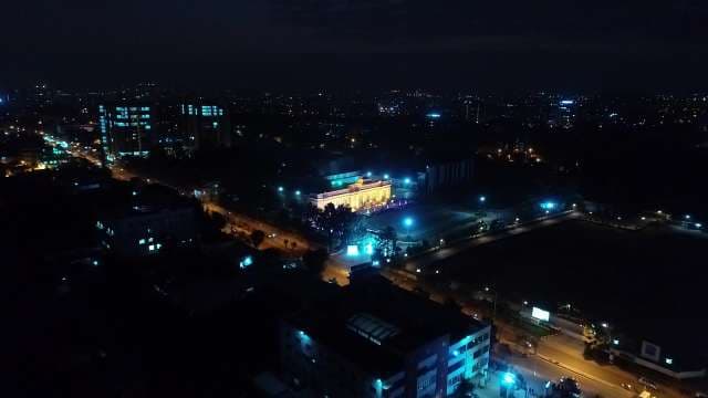 Stunning Night Cityscape: Illuminated Urban Skyline Aerial View