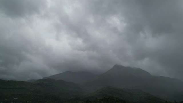 Stormy Mountain Peak Shrouded in Dramatic Storm Clouds